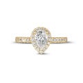 0.70Ct halo ring in yellow gold with pear diamond