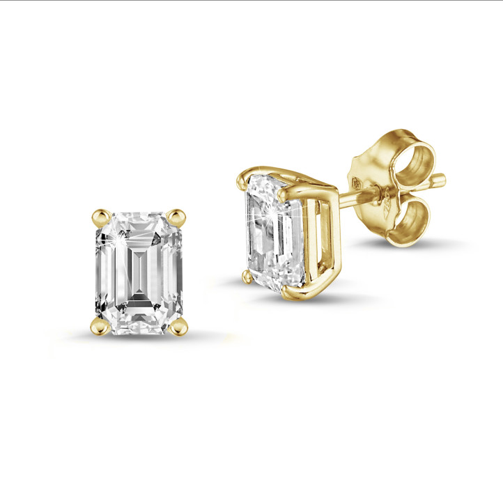 2.00 carat solitaire emerald cut diamond earrings in yellow gold