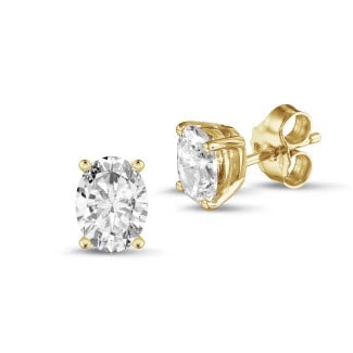2.00 carat solitaire oval cut diamond earrings in yellow gold