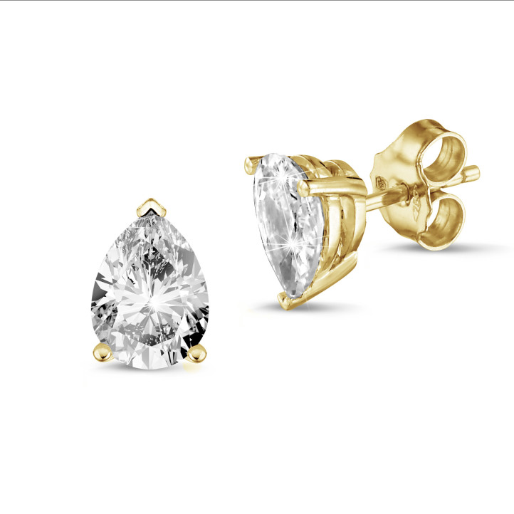 2.00 carat solitaire pear cut diamond earrings in yellow gold