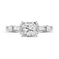 1.00 carat trilogy ring in white gold with a princess diamond and tapered baguettes