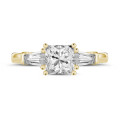 1.00 carat trilogy ring in yellow gold with a princess diamond and tapered baguettes