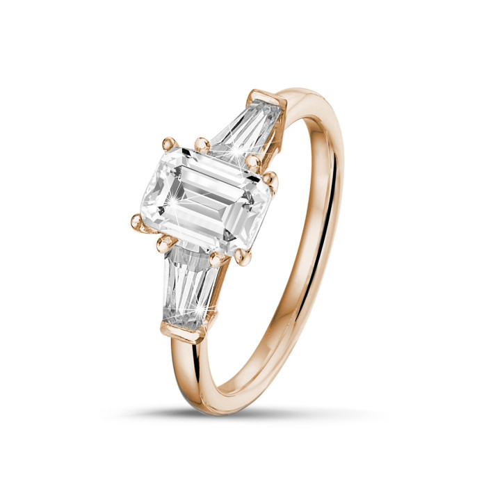 1.00 carat trilogy ring in red gold with an emerald cut diamond and tapered baguettes