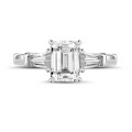 1.00 carat trilogy ring in platinum with an emerald cut diamond and tapered baguettes