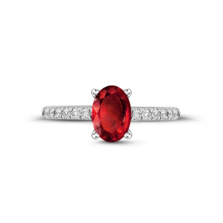 ルビー、サファイヤ、エメラルド付きのジュエリー - Ring in white gold with oval ruby and side diamonds
