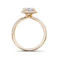 0.70 carat solitaire halo ring with an asscher cut diamond in red gold and round diamonds