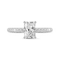 0.70 carat solitaire ring with a radiant cut diamond in white gold with side diamonds