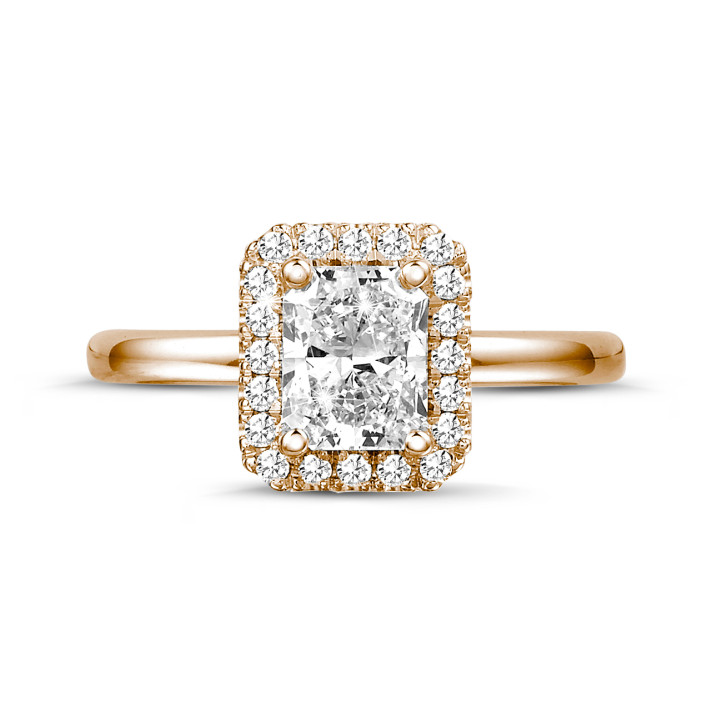 0.70 carat solitaire halo ring with a radiant cut diamond in red gold with round diamonds