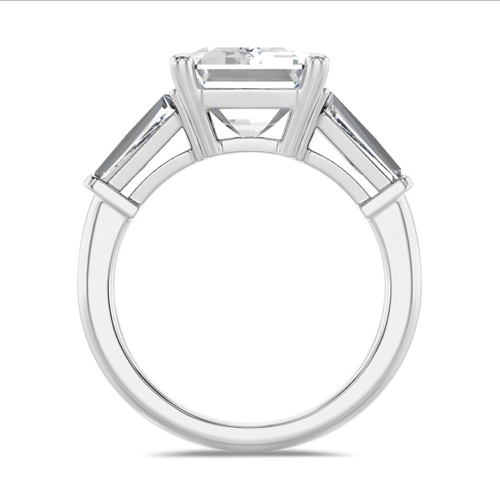 Bespoke trilogy ring with an emerald cut diamond and tapered baguettes
