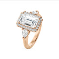 Bespoke trilogy ring with an emerald cut diamond and side pear cut diamonds