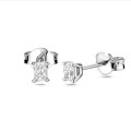 0.30 carat solitaire earrings with radiant cut diamonds in white gold