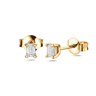 新商品 - 0.30 carat solitaire earrings with emerald cut diamonds in yellow gold
