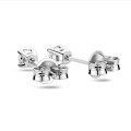 0.30 carat solitaire earrings with round cut diamonds in white gold