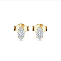 0.30 carat solitaire earrings with marquise cut diamonds in yellow gold