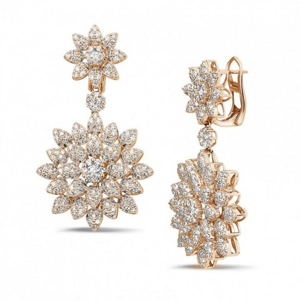 Pendientes en oro rojo con forma de estrella BAUNAT como propuesta para que forme parte de la colección de joyería.