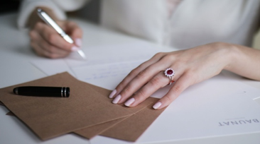 Woman wearing a ring with ruby and diamond from BAUNAT