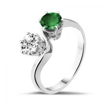 An exquisite BAUNAT engagement ring showcasing one emerald stone and one natural diamond 