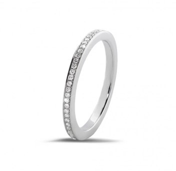 a 0.22 carat diamond eternity ring in white gold, featuring a traditional classic wedding ring design