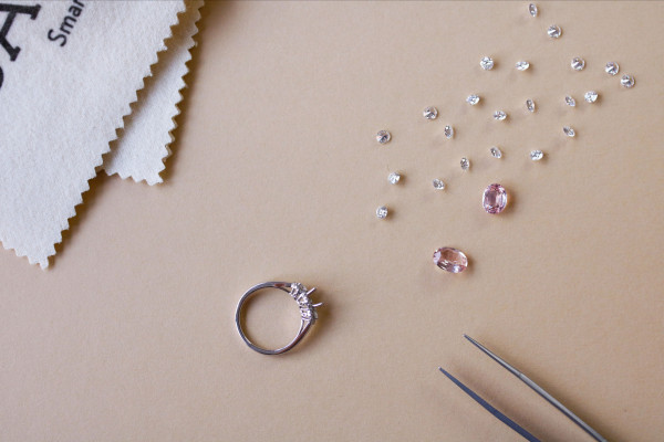 a diamond ring, scissors, and cloth for full diamond creation