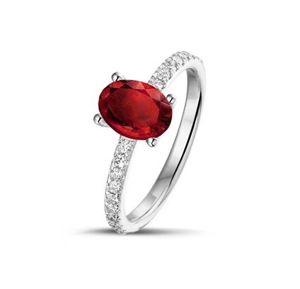 An elegant oval ruby and diamond ring set in white gold, showcasing the significance of red in Chinese culture