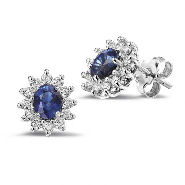 White gold sapphire and diamond stud earrings with oval blue center stones and halo settings