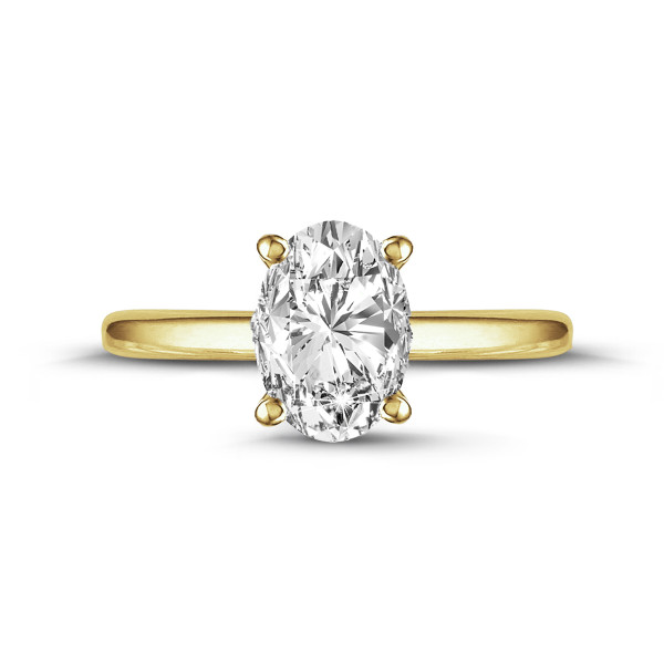 Yellow gold solitaire ring with a large oval-cut diamond in a four-prong setting