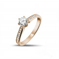 0.50 karaat diamanten solitaire ring in rood goud met zijdiamanten
