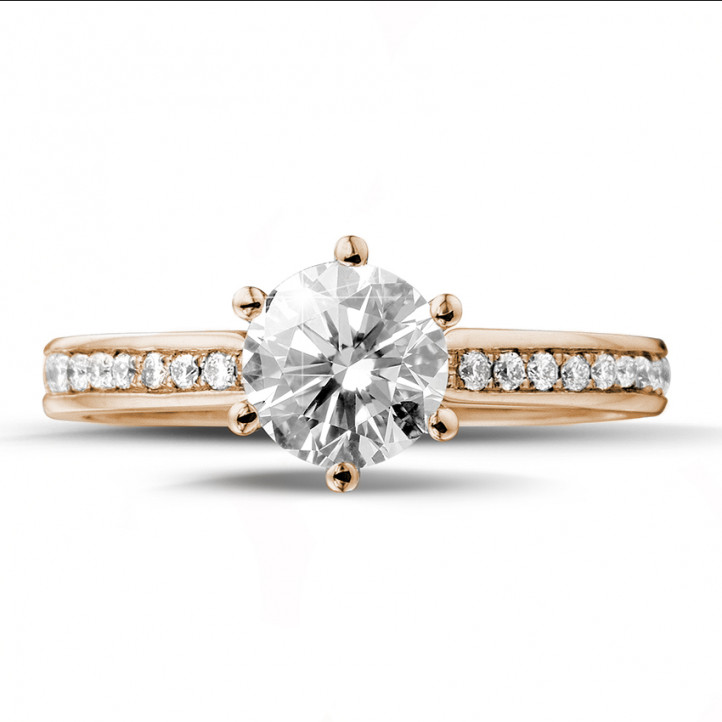 0.90 karaat diamanten solitaire ring in rood goud met zijdiamanten