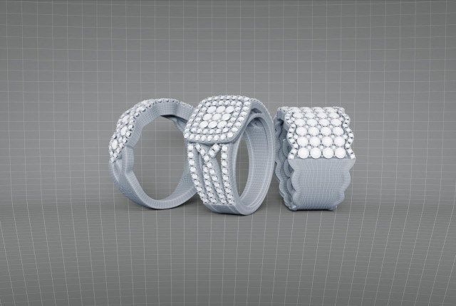 3D-geprinte sieradenschets van drie ringen met pavé gezette diamanten in witgrijze was 3D printen van juwelen als innovatie in de juwelensector.