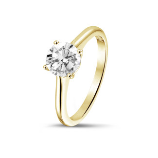 Ringen - 1.00 karaat solitaire ring in geel goud met ronde diamant en vier griffen