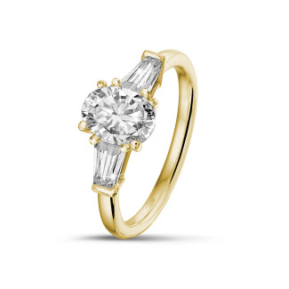 Verlovingsring goud - 1.00 karaat trilogie ring in geelgoud met ovale diamant en conische baguettes