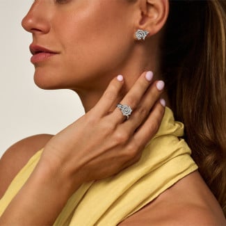 Oorbellen - 1.00 karaat diamanten oorbellen met roosmotief in witgoud