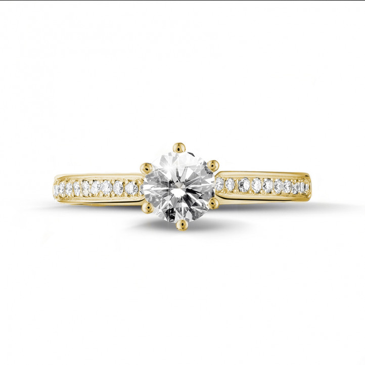 0.70 karaat diamanten solitaire ring in geel goud met zijdiamanten