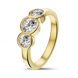Verloving - 0.95 karaat trilogie ring in geel goud met ronde diamanten