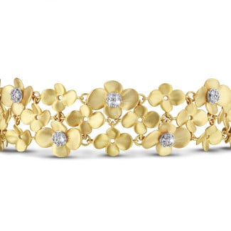 Armbanden dames - 0.75 karaat diamanten design bloemenarmband in geel goud