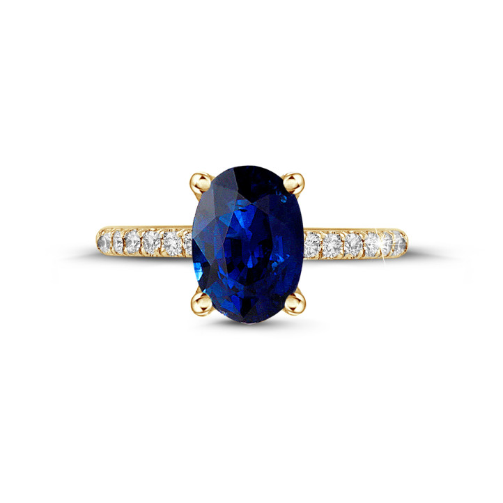 Oval safir ve yanları pırlantalı sarı altın yüzük