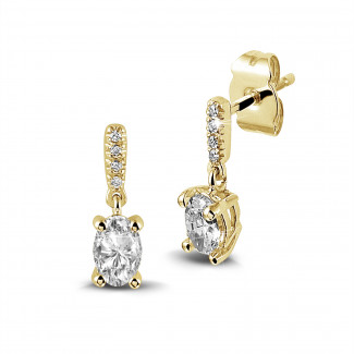 0.94 karat oval pırlantalı sarı altın küpe